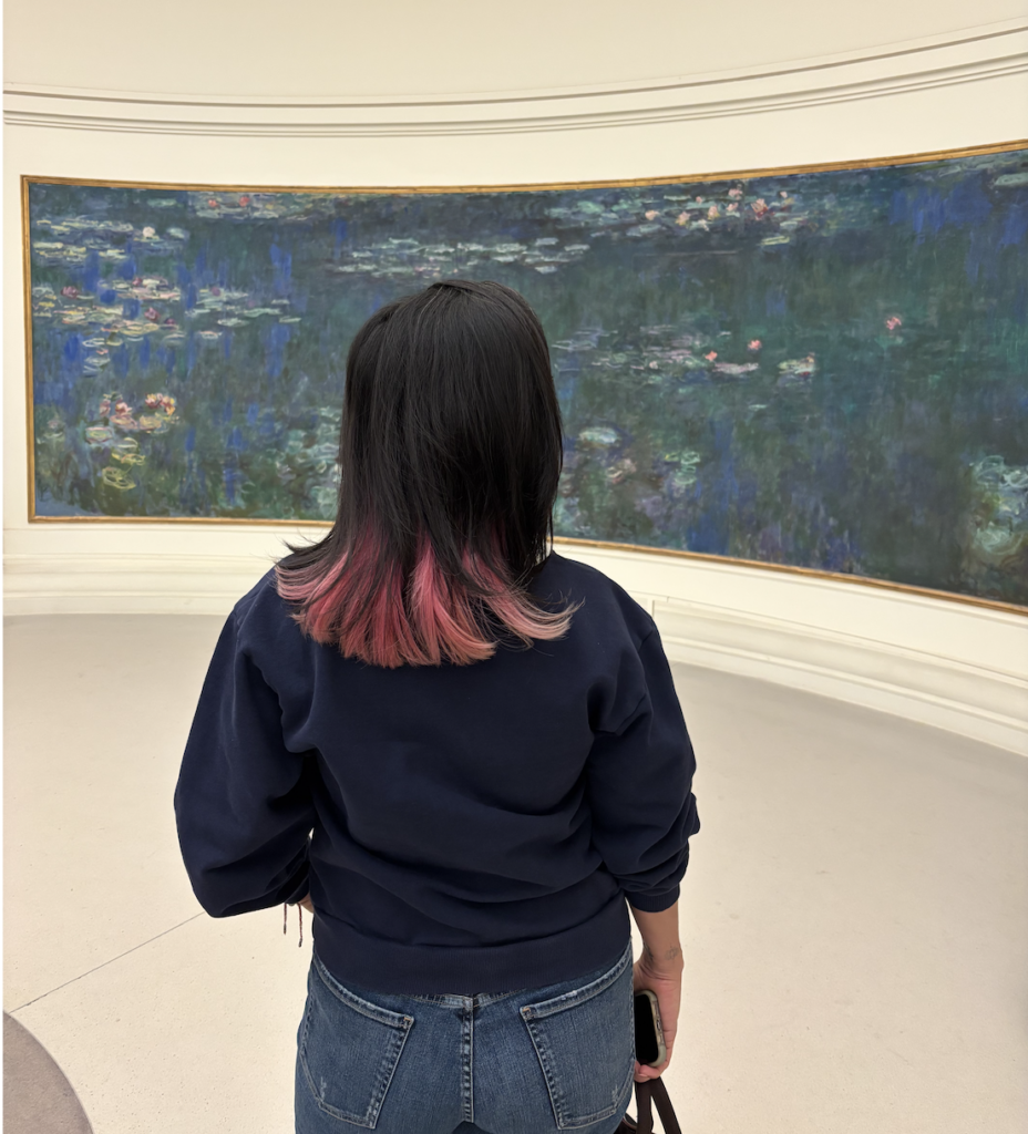 Sylvia Sulkes, founder of Sol Kiss Escapes, viewing Monet's Water Lilies- Paris 2026